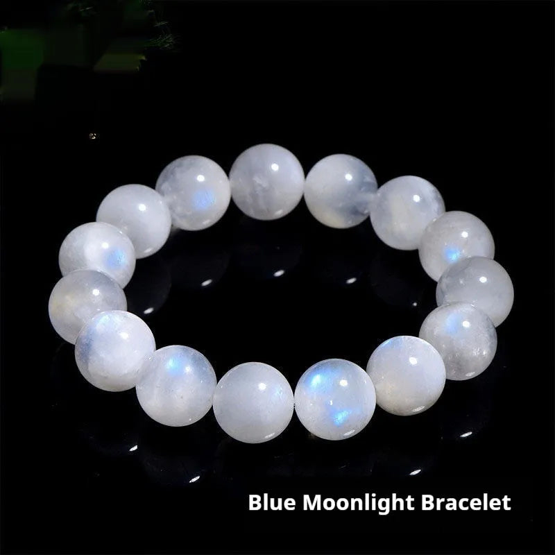 Natural blue moonlight round moonstone bead bracelet on a white background showing polished gemstone beads.