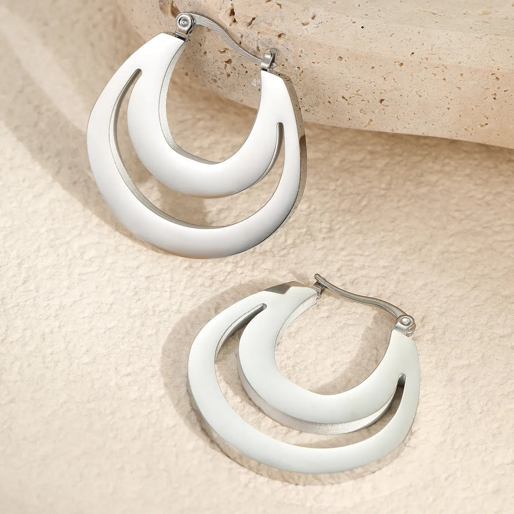 Metallic French geometric earrings with gold plating on stainless steel, featuring round ring elements