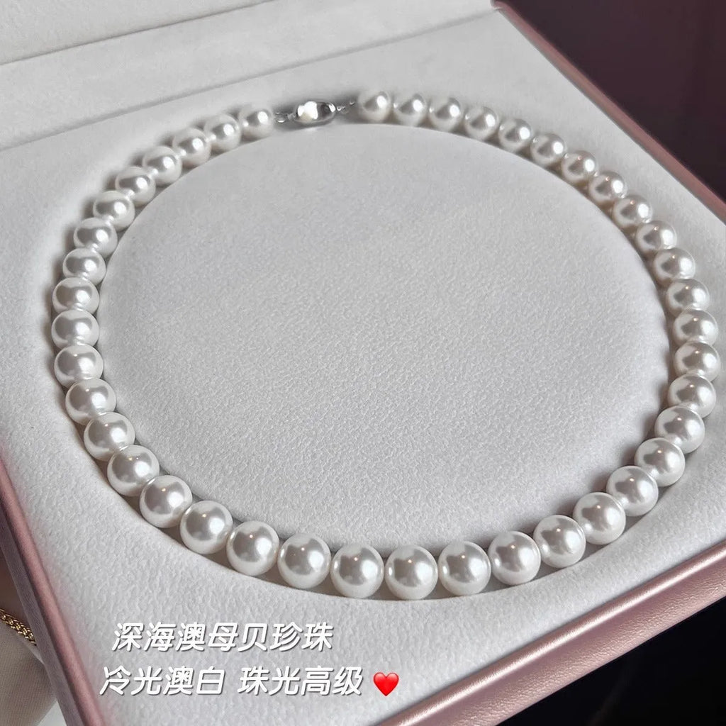 925 silver ingot buckle necklace with Australian white shell pearls on a model, unisex clavicle chain style