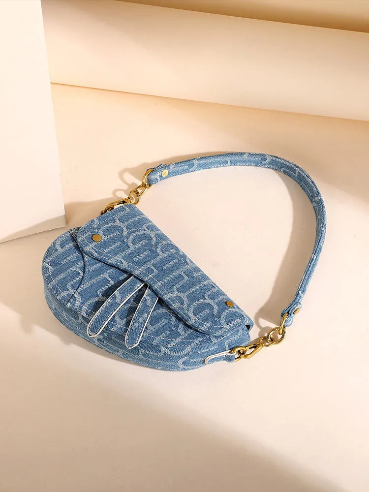 Women's vintage denim saddle bag in blue cross body bag with soft PU surface and zip pocket interior
