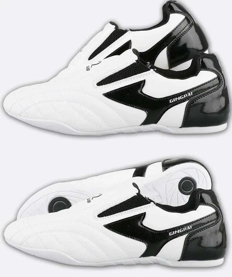 Black and white children's martial arts training shoes with a soft bottom and widened fit for Sanda and Taekwondo.