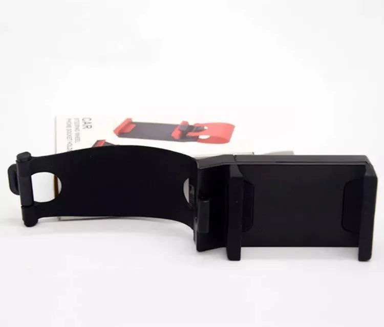 Black ABS plastic car steering wheel phone holder showing mounting position