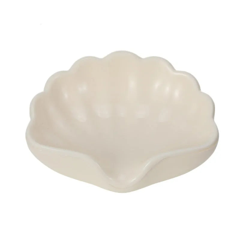 Plastic shell-shaped soap dish in pearl white colour for bathroom use