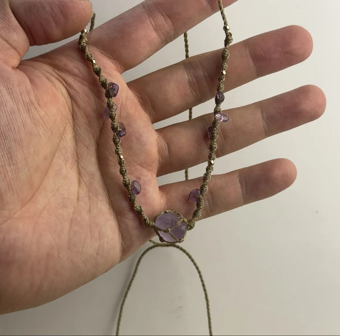 Artificial crystal rough labradorite-style pendant necklace with O-link chain on display