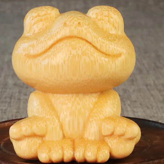 Solid bamboo carving ornament with smiling frog design measuring 5cm height