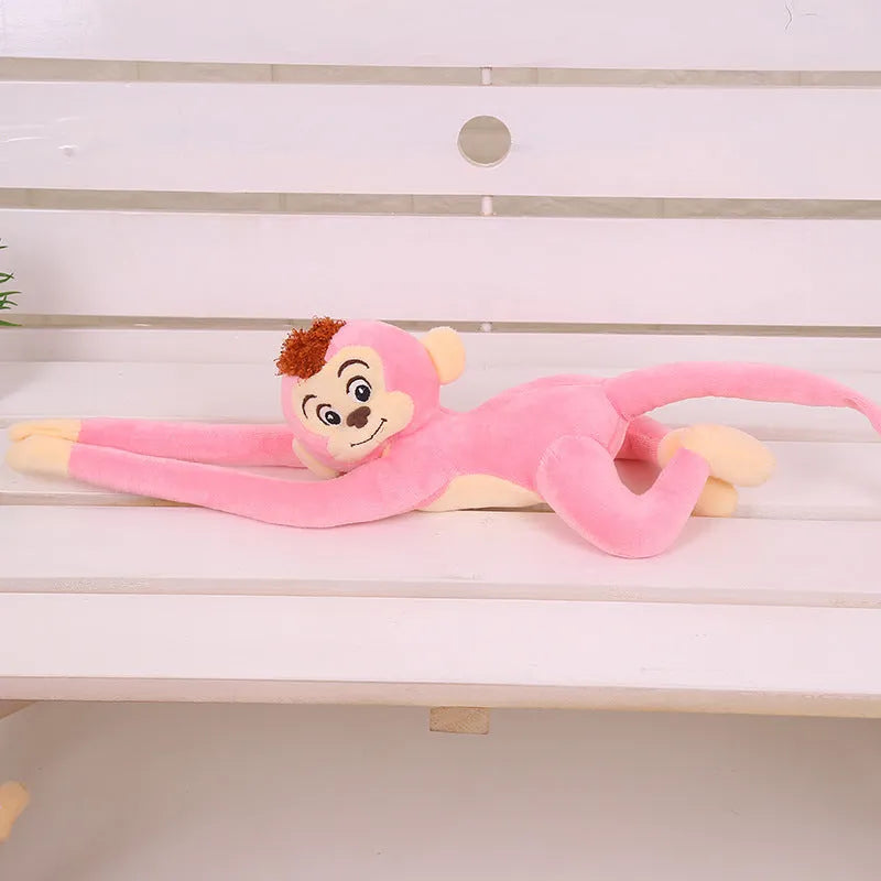 Long arm plush monkey toy hanging as curtain decoration in pink, wine red, dark brown, or light brown