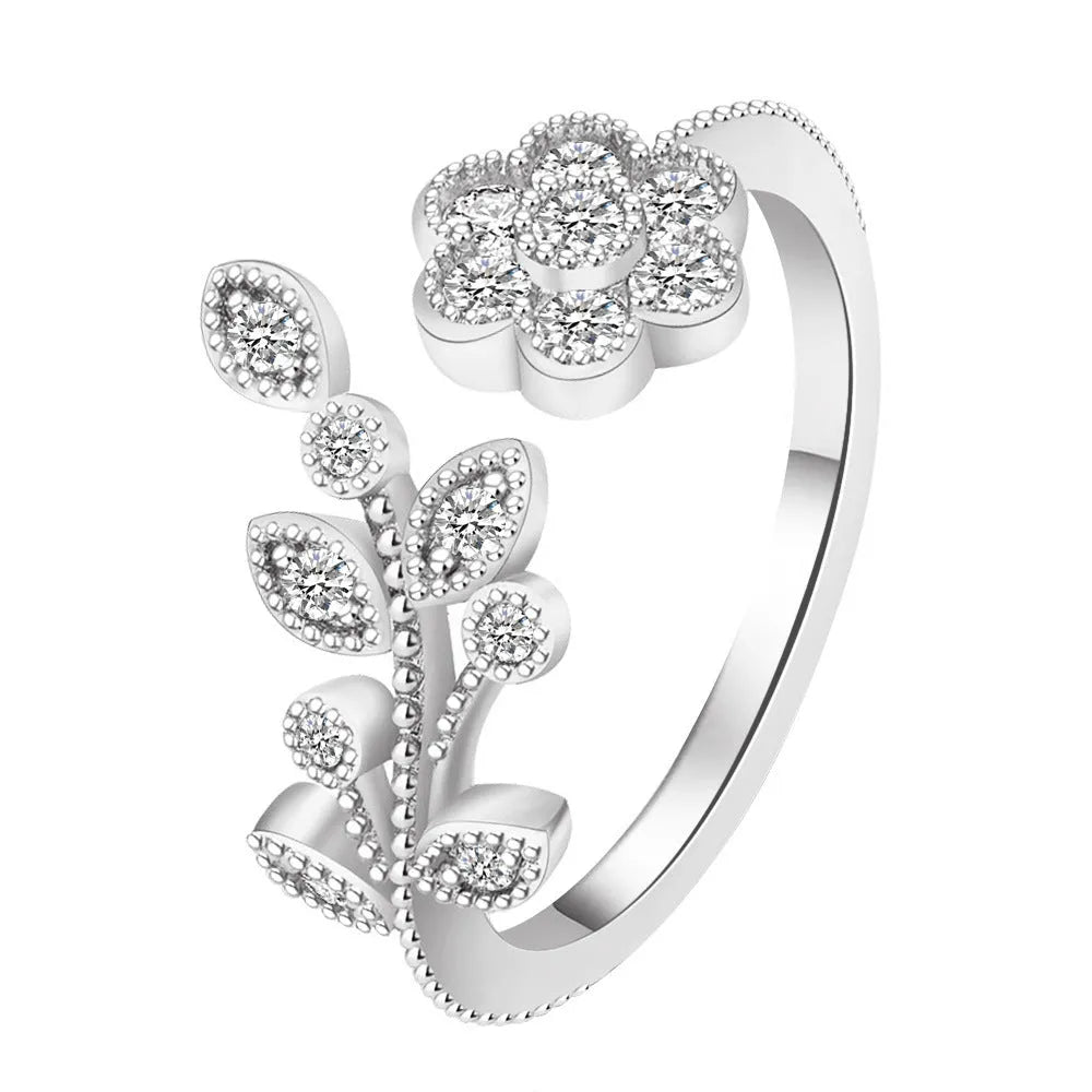 Women's diamond flower leaves open ring in gold and white colour options showing floral design