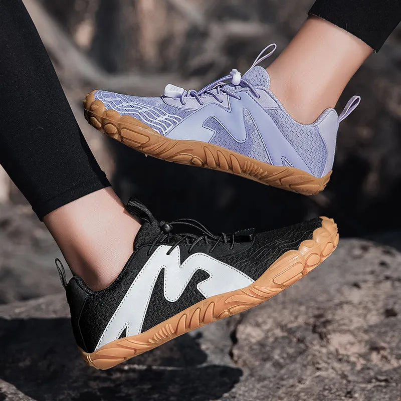 A pair of white and grey couple sports climbing shoes with Flyknit lining on a neutral background.
