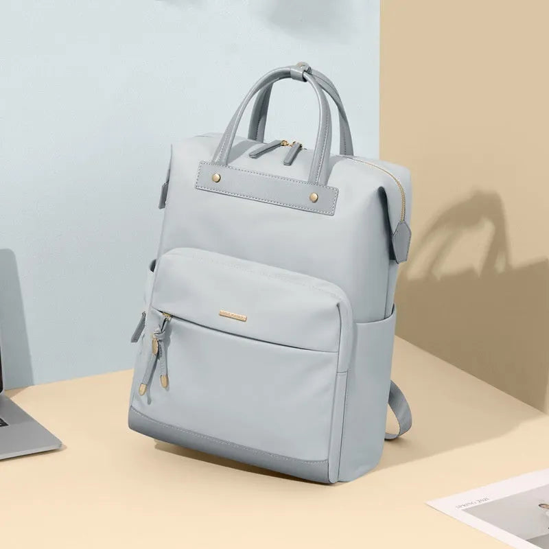 Women's large synthetic leather backpack in apricot colour with adjustable shoulder strap.
