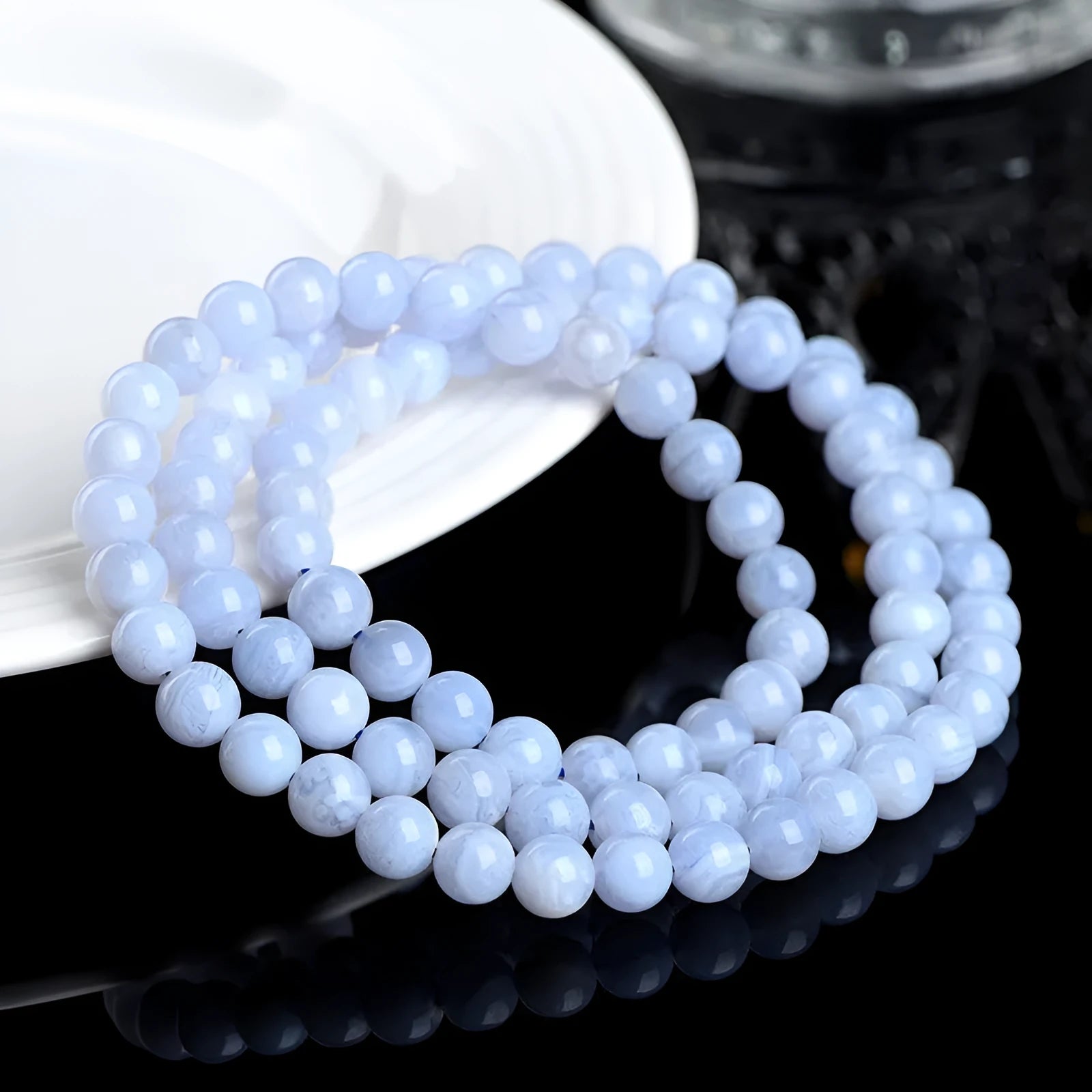 Blue agate bracelet with scattered striped beads and traditional ruyi design elements