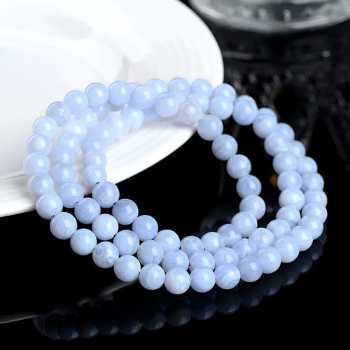 Blue agate bracelet with scattered striped beads and traditional ruyi design elements