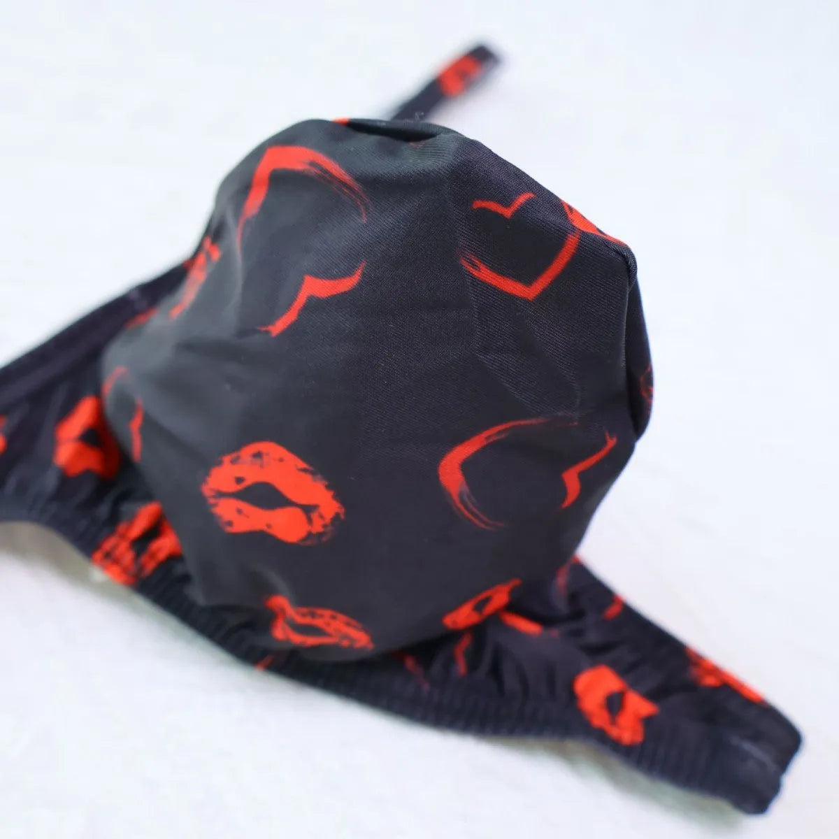 Men's low waist T-back shorts with couple theme cartoon pattern in black colour