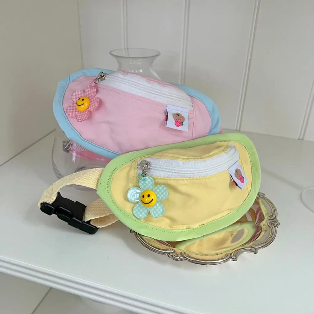 Powder blue messenger-style backpack pet carrier with a poop bag compartment, shown with sizing tape.