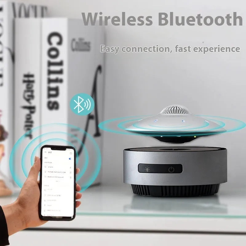 Automatic lifting magnetic levitation Bluetooth speaker hovering above its base.