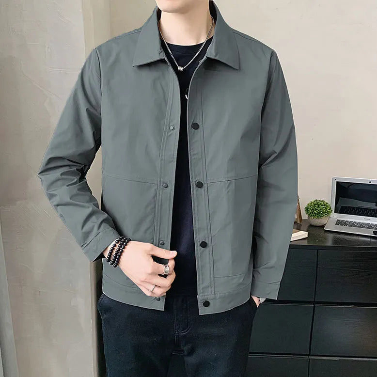 Man wearing a lightweight grey single-layer Korean-style jacket for spring or autumn.