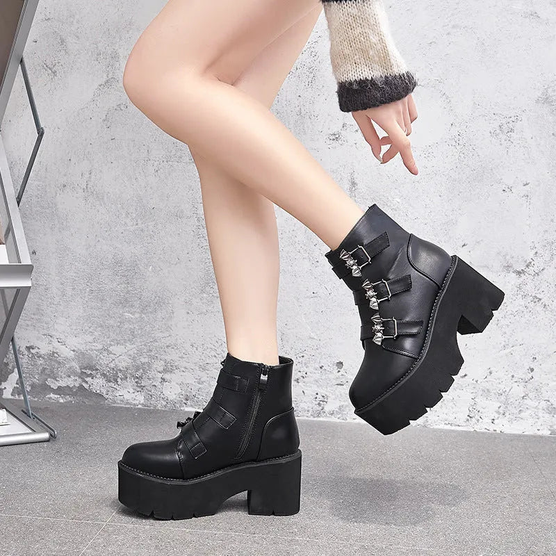 Black women's punk-style short Martin boots featuring a bat buckle, side zipper, and thick heel