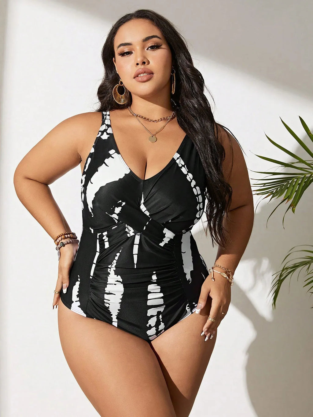 Black Siamese colour matching fit one-piece swimsuit on a hanger.