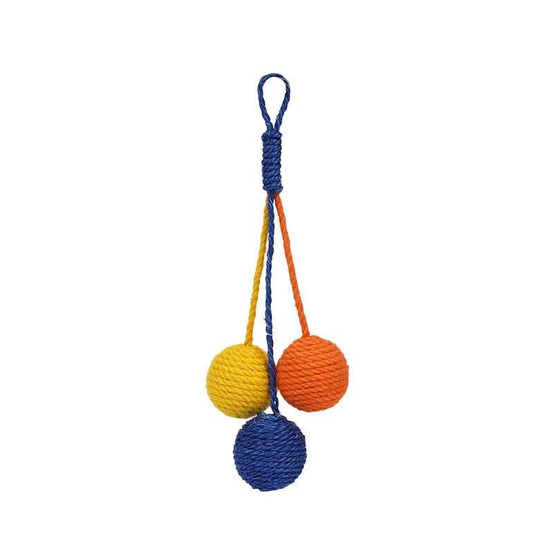 Cat toy set with blue and green teaser stick, red and yellow catnip balls, and a tumbling pet on a white background