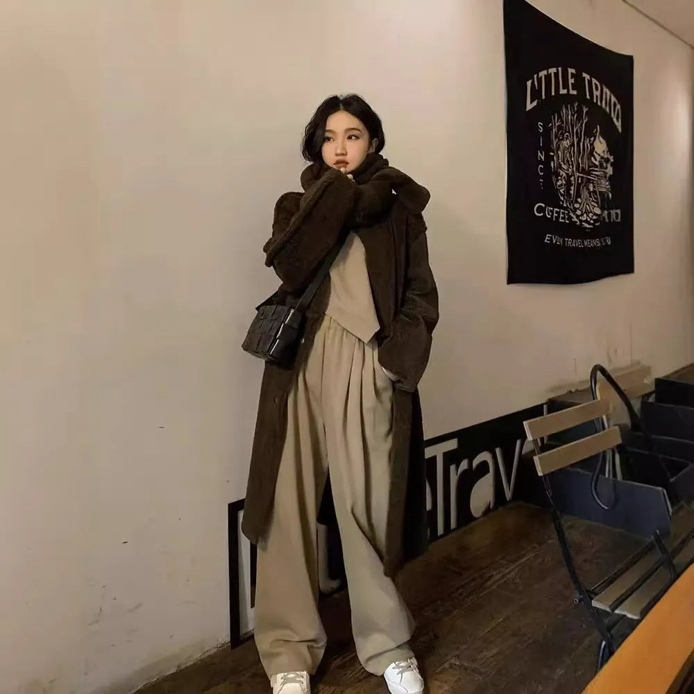 Women's khaki casual sports suit set with long sleeve top and trousers on a hanger