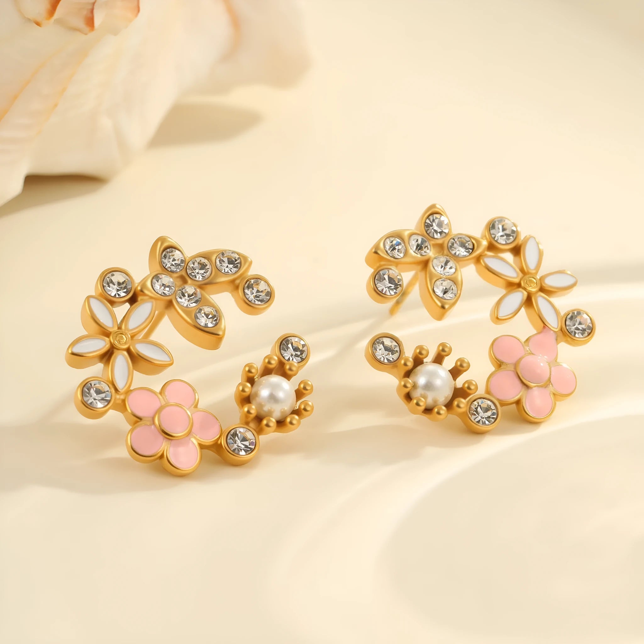 Colourful oil diamond flower stud earrings with gold plating on stainless steel.