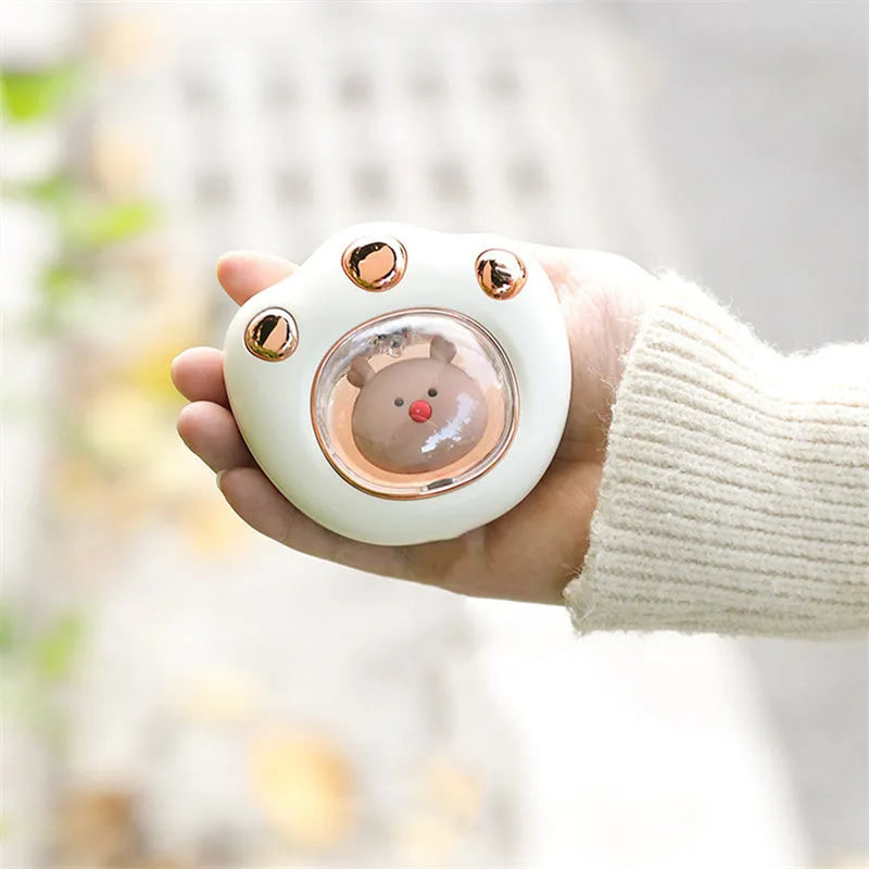 Mini electric hand warmer in cat paw shape, USB rechargeable, in white colour option, palm-sized