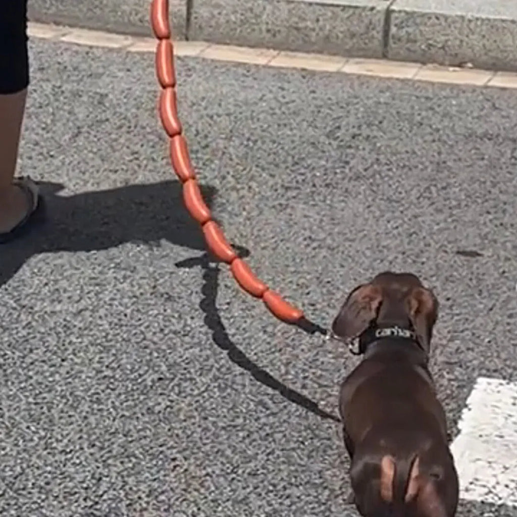 Brown sausage-style dog rope toy with hand grip tape, shown at full 108cm length