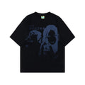 Men's grey loose-fit t-shirt featuring a retro character print design on the front.