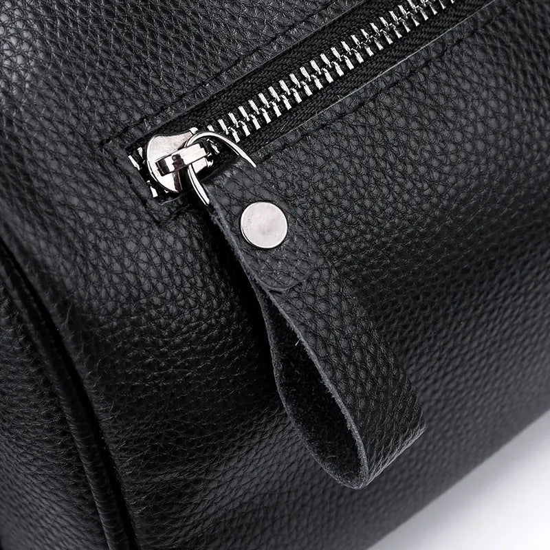 Black genuine leather one-shoulder crossbody bag showing front view and dimensions