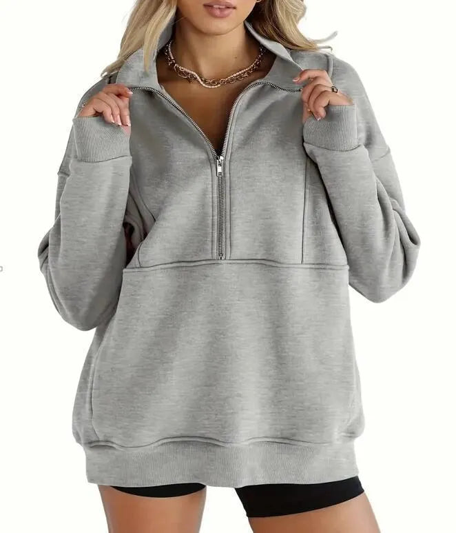 Women's loose polyester brushed hoody with zipper pocket in street hipster style, roomy fit, thick fabric