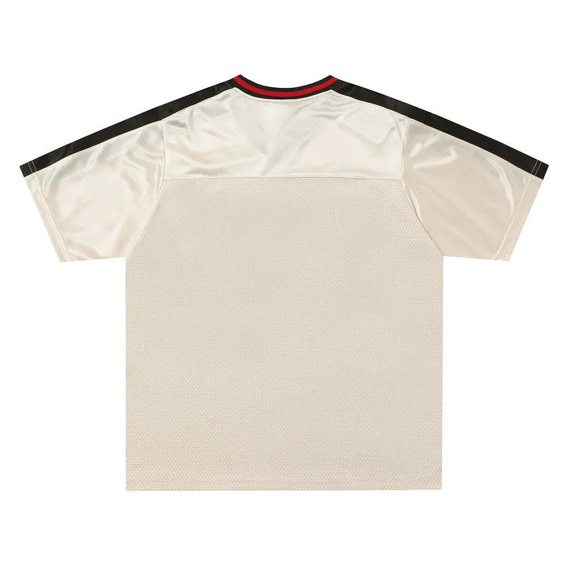 Apricot coloured men's V-neck loose sports jersey with letter print and drop shoulder sleeves.