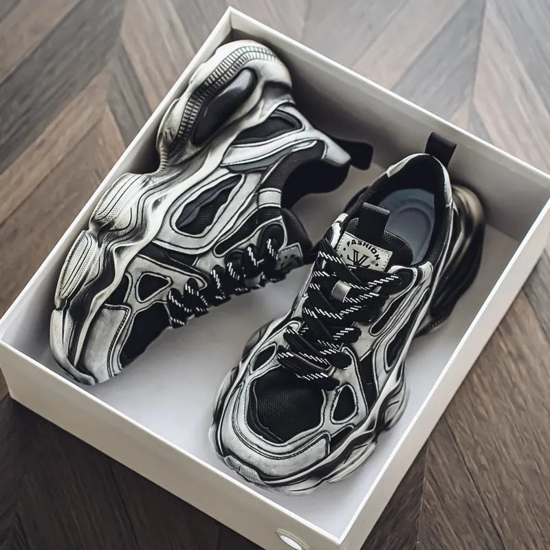 Men's low-top mesh sneakers in grey with a platform sole and lace-up front, on a white background.