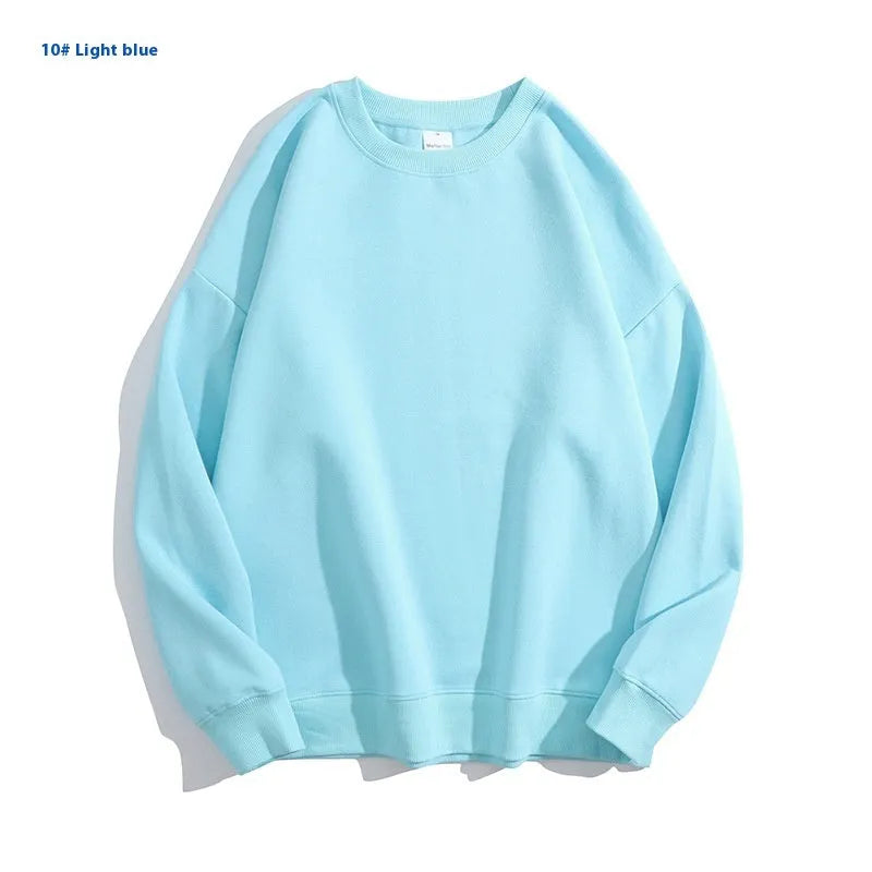 Loose-fitting, cotton, off-shoulder knit sweater in a solid colour on a hanger.