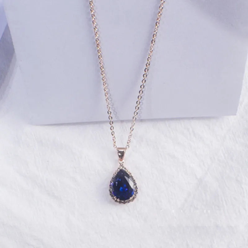 Rose gold water drop necklace with geometric rhinestones in pink colour
