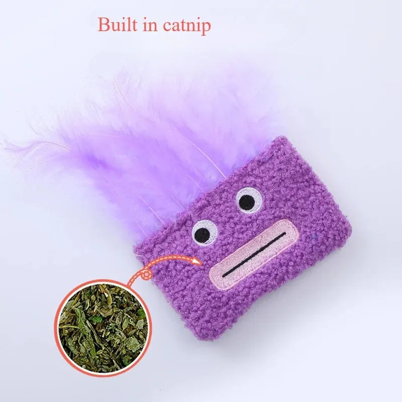 Cat plush toy with big mouth explosion head shape in blue, green, orange, and purple colours