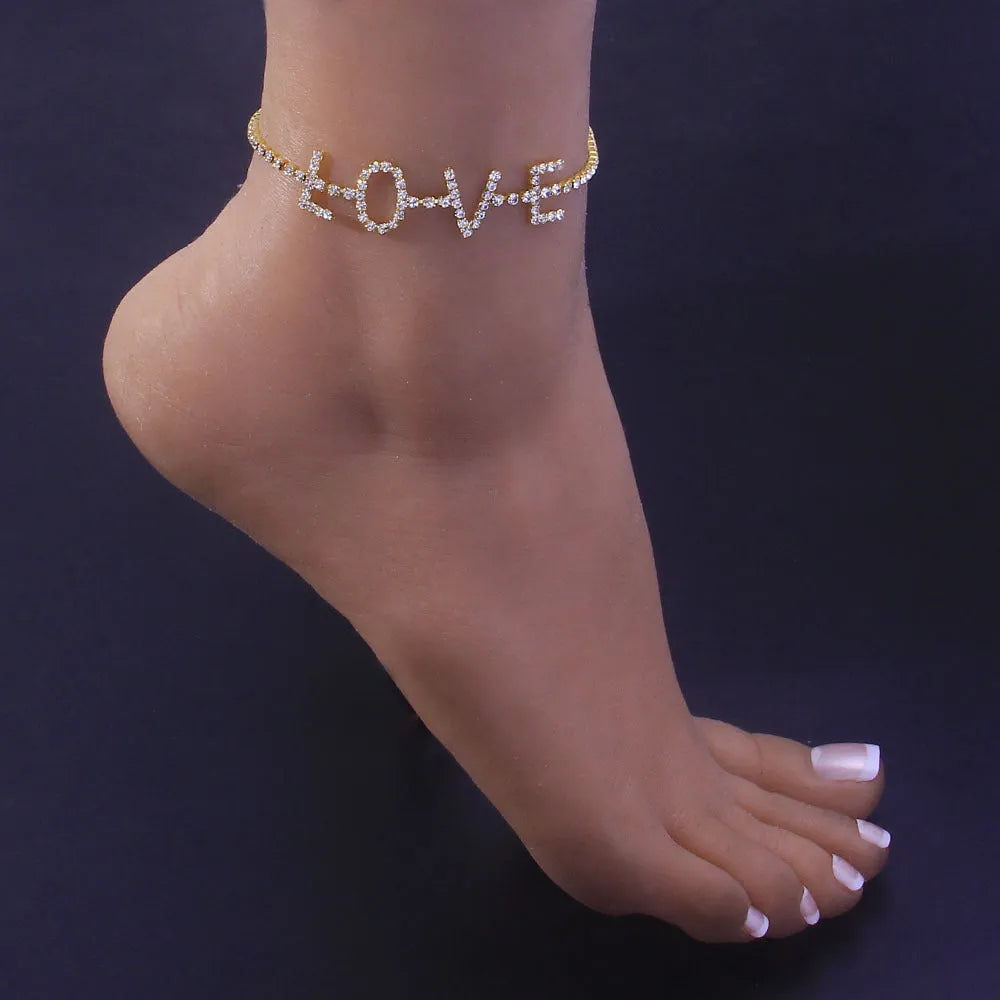 Gold letter anklet spelling LOVE with clear rhinestones on copper chain