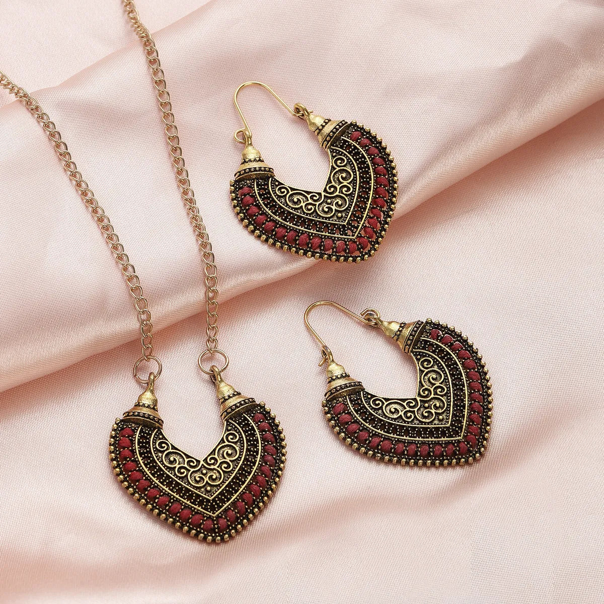 Rope winding heart-shaped earrings and matching necklace set with electroplated alloy pendants, shown in one of five colours