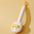 Small yellow duck-shaped pet grooming comb with open needle brush for cats and dogs