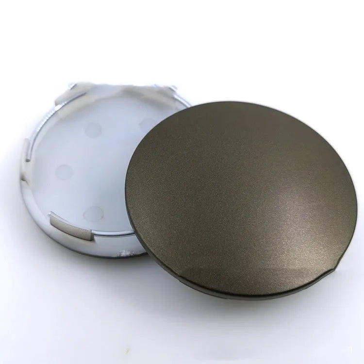 65mm diameter ABS plastic car hub centre cover in antique copper finish with aluminium label.