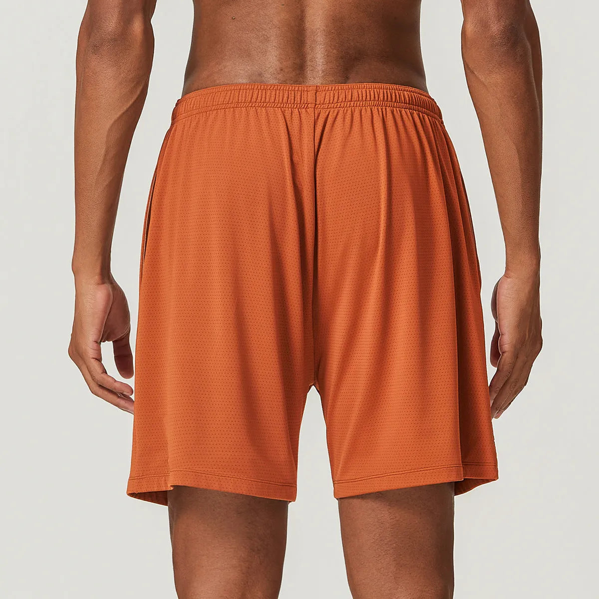 Men's quick-drying double-layer running shorts in sky green, showing mid-waist short length design.