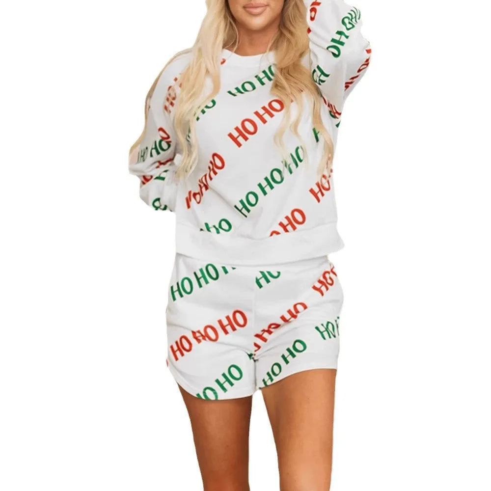 White women's two-piece suit with black letters printed design, featuring long sleeves and coordinated trousers