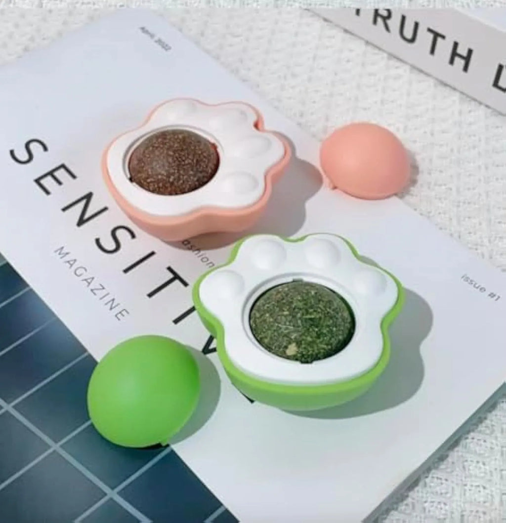 Blue, green, and pink edible vine catnip balls for dental chewing and play