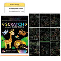 DIY graffiti scraping painting paper kit with scratch tool, showing colourful animal theme artwork revealed on black paper
