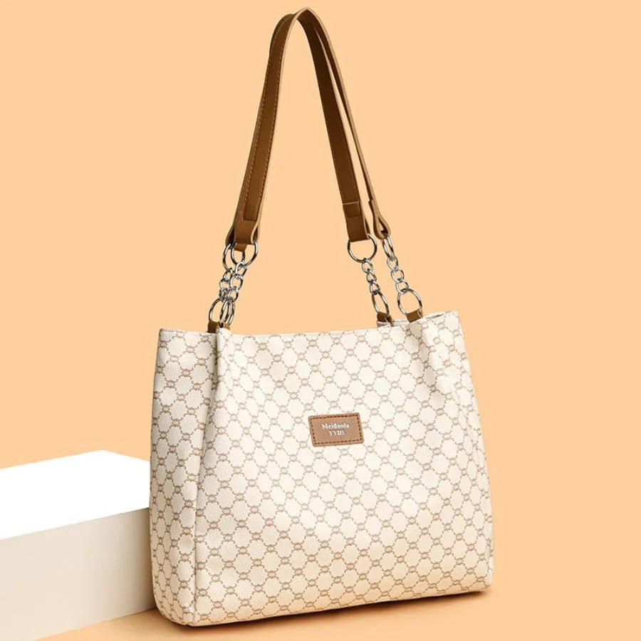 Women's retro style handbag in soft brown PU leather with a polyester lined interior.