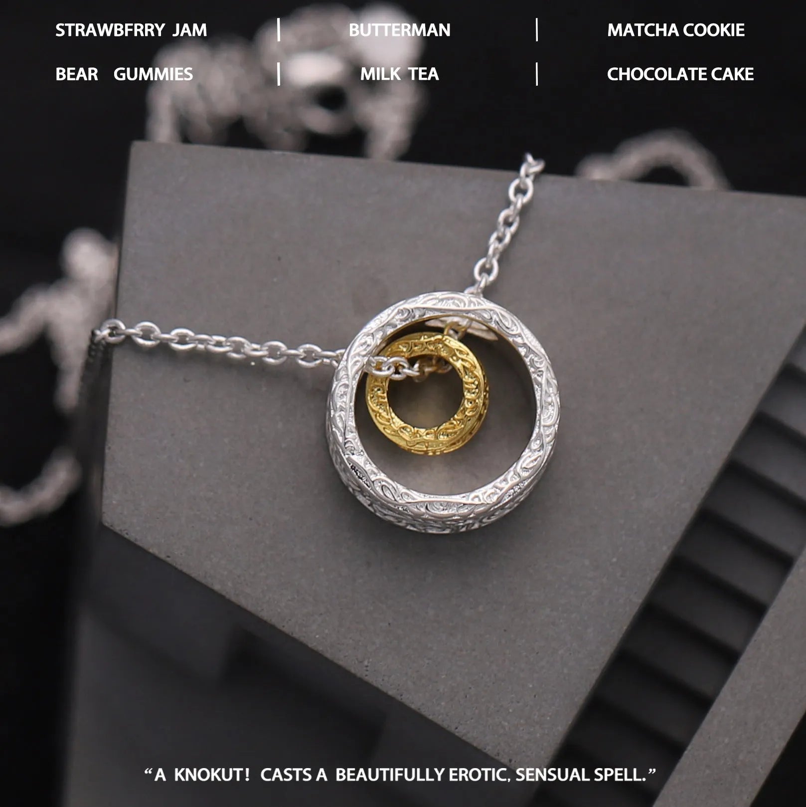 Geometric copper nested necklace with gold and silver electroplated finish, round and ring elements, on display