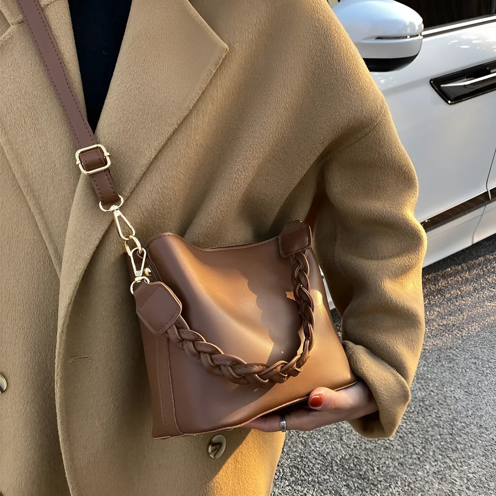 Retro brown PU bucket bag with weaving detail, shown as a one-shoulder crossbody underarm bag.