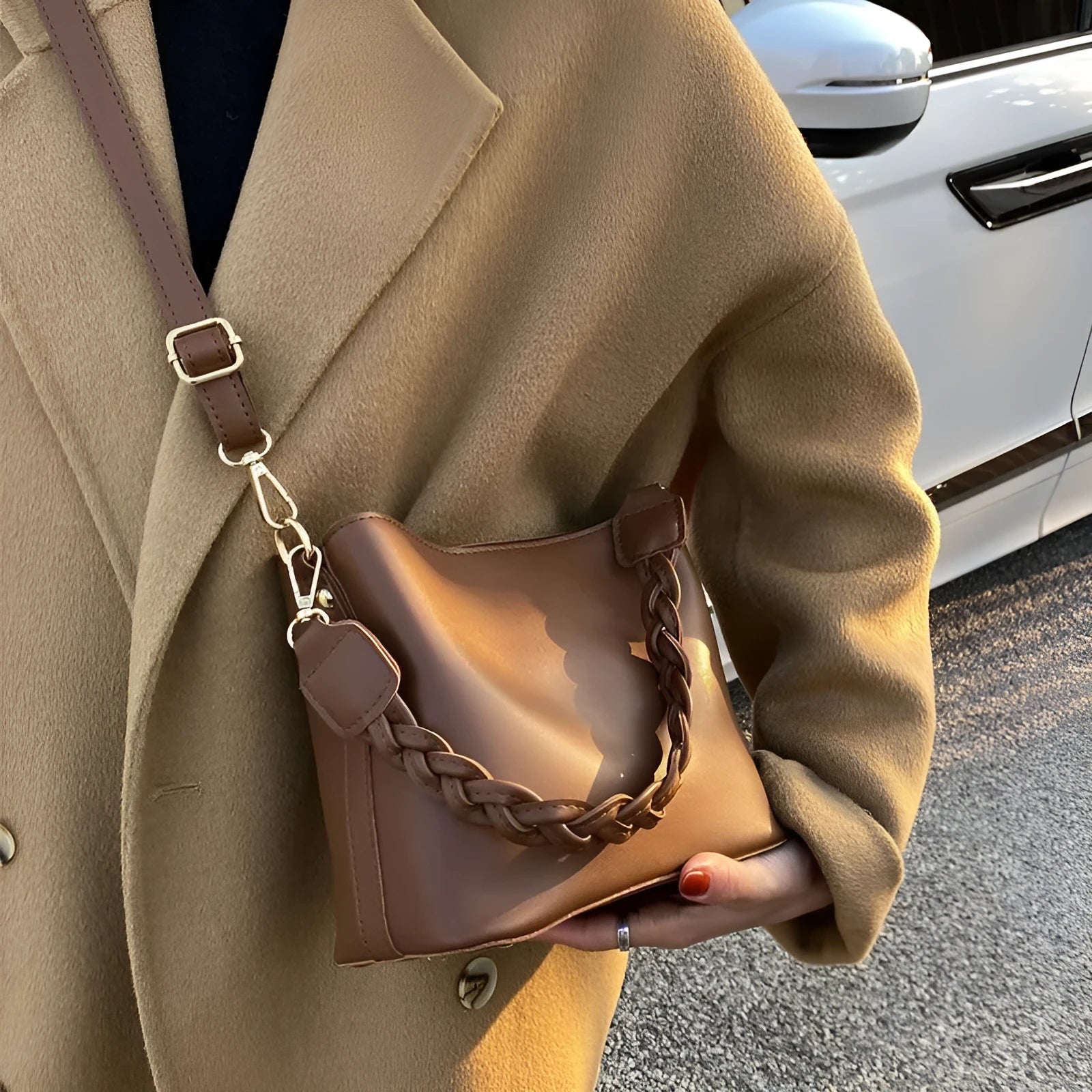 Retro brown PU bucket bag with weaving detail, shown as a one-shoulder crossbody underarm bag.