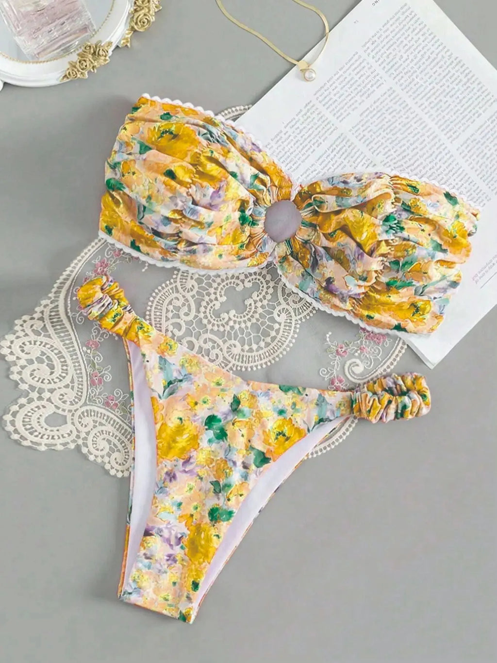 Colourful floral print bikini set with tube top and briefs on a hanger.