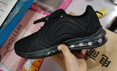 Men's black casual air cushion sneakers with lace-up front and thick sole.