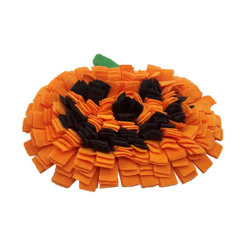 Orange pumpkin-shaped pet slow feeder mat with woollen pad on polar fleece.