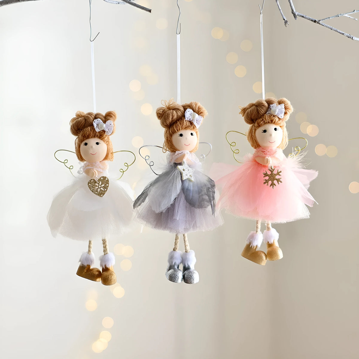 White Christmas tree hanging ornament with mesh angel girl design, snowflake styling, and metal, plastic, and cloth construction.